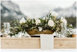small outdoor winter wedding, wooden table, floral centerpiece